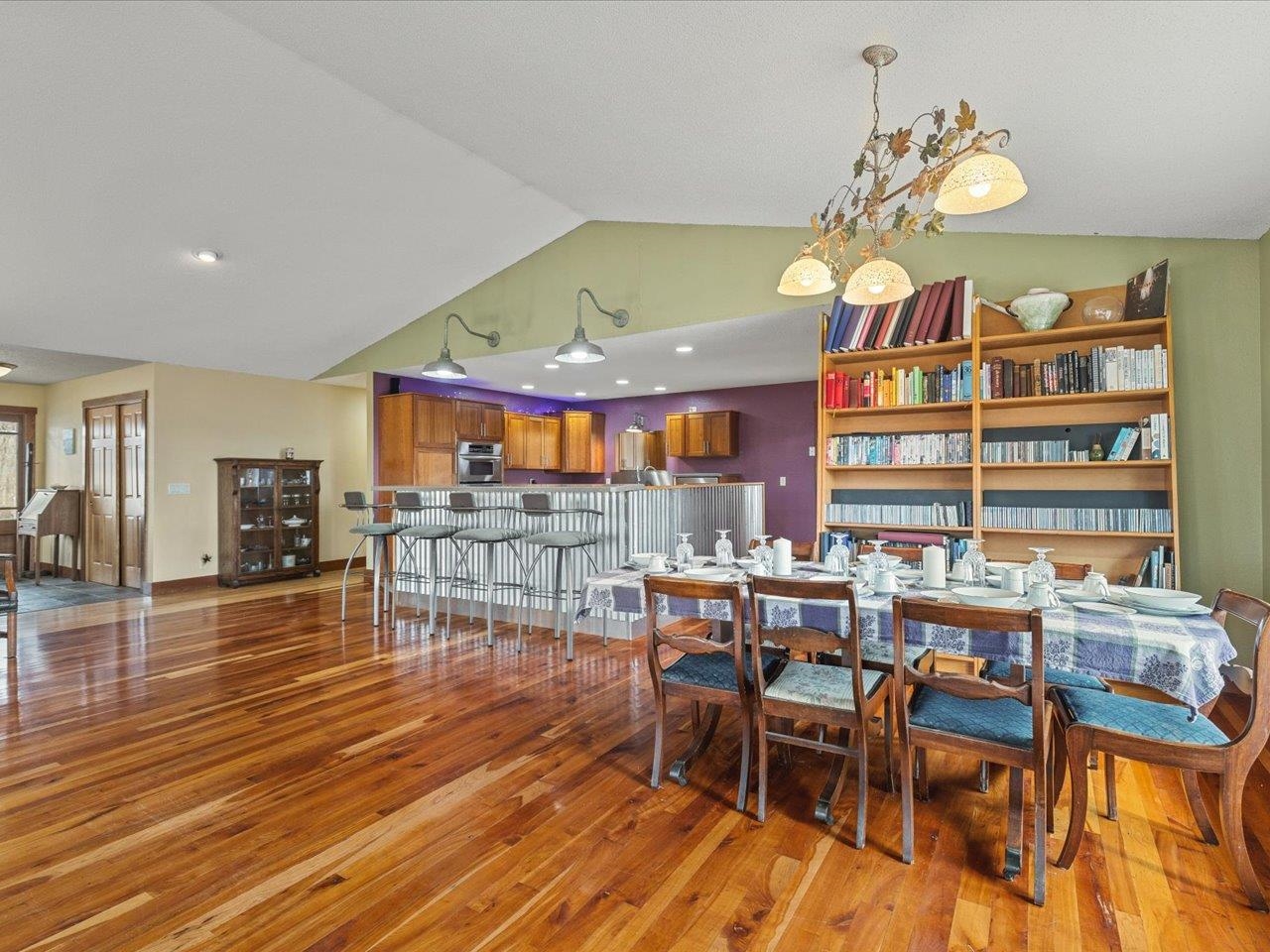 11660 Farm School Road Durand, IL 61024 - Photo 9 of 47 a view of a dining room and livingroom with furniture wooden floor and a fireplace
