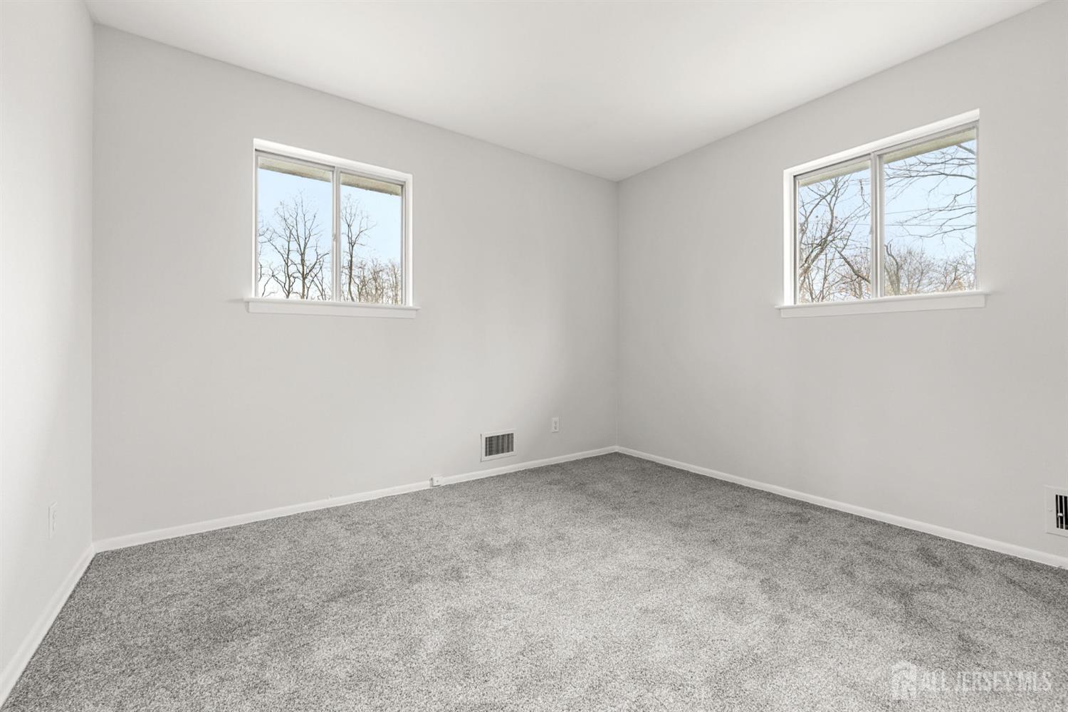 89 Van Buren Avenue, Unit 2 Metuchen, NJ 08840 - Photo 5 of 16 a view of an empty room with a window