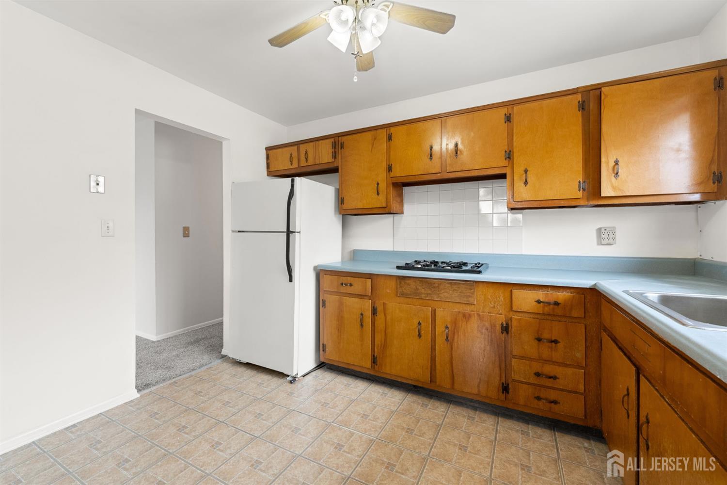 89 Van Buren Avenue, Unit 2 Metuchen, NJ 08840 - Photo 10 of 16 a kitchen with stainless steel appliances granite countertop a sink and cabinets