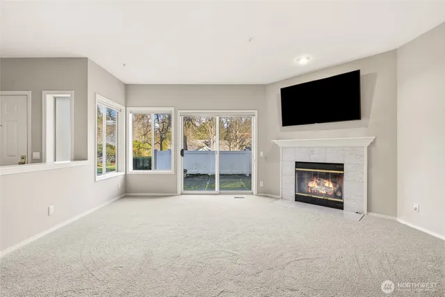 a view of livingroom with furniture fireplace and television