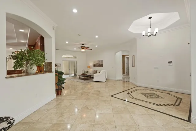 a kitchen with stainless steel appliances granite countertop a refrigerator and a stove