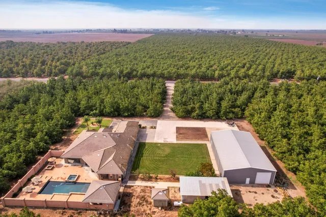 a view of a city with lots of residential buildings and mountain view in back