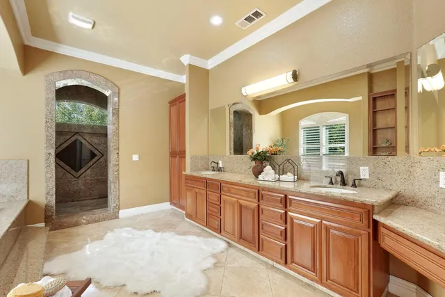 a view of a house with swimming pool and sitting area