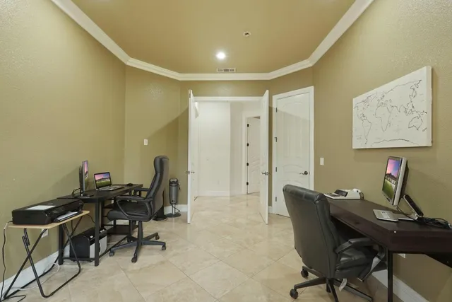 a view of a patio with swimming pool table and chairs
