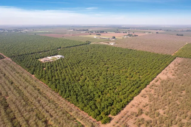 an aerial view of a house with a garden