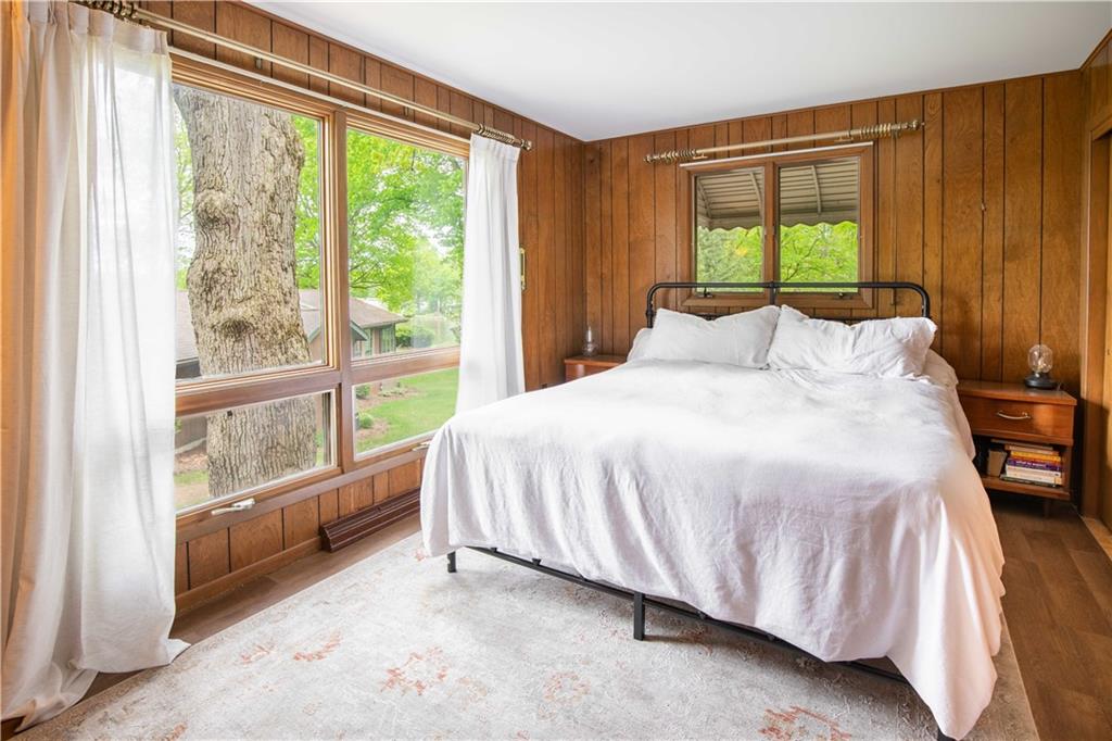 906 Aztec Trail Mercer, PA 16137 - Photo 12 of 27 a bedroom with a bed and a large window