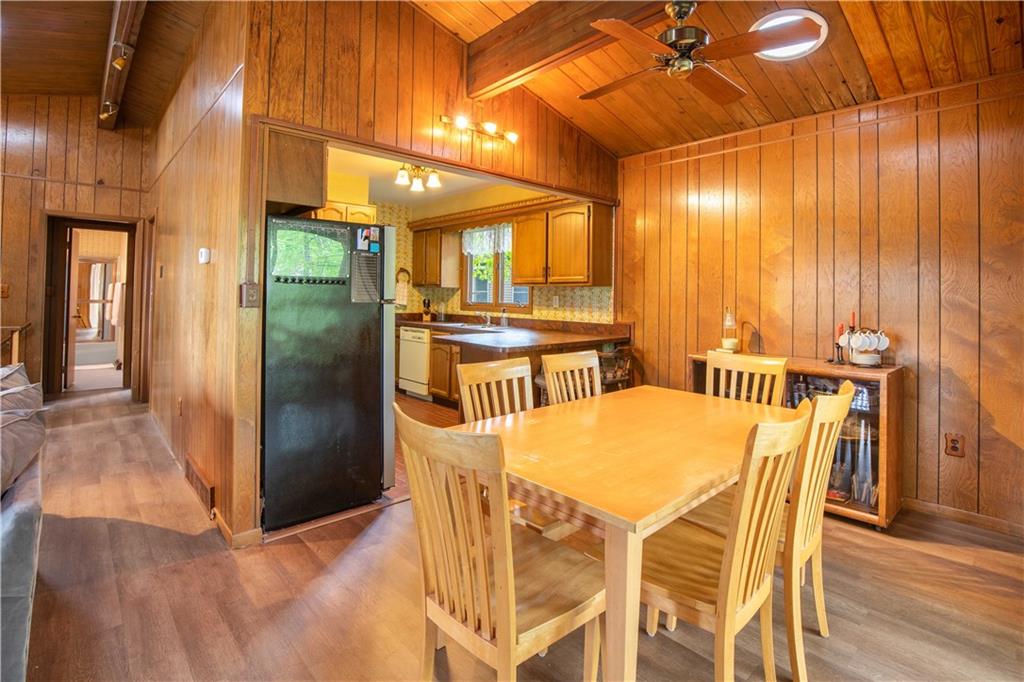 906 Aztec Trail Mercer, PA 16137 - Photo 7 of 27 a dining room with stainless steel appliances a table and chairs