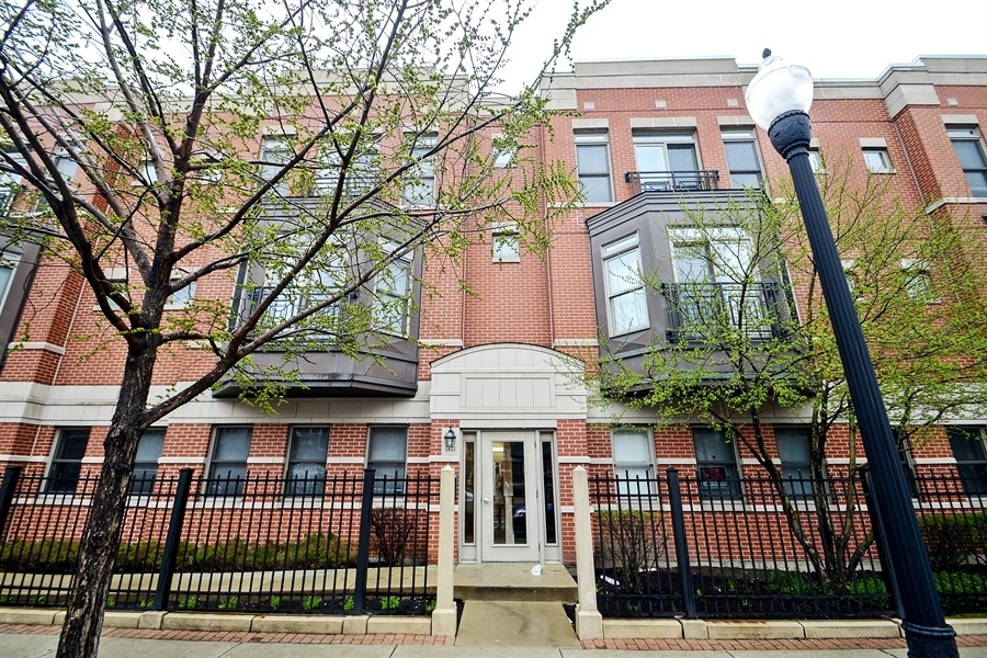 front view of a house with a iron gate