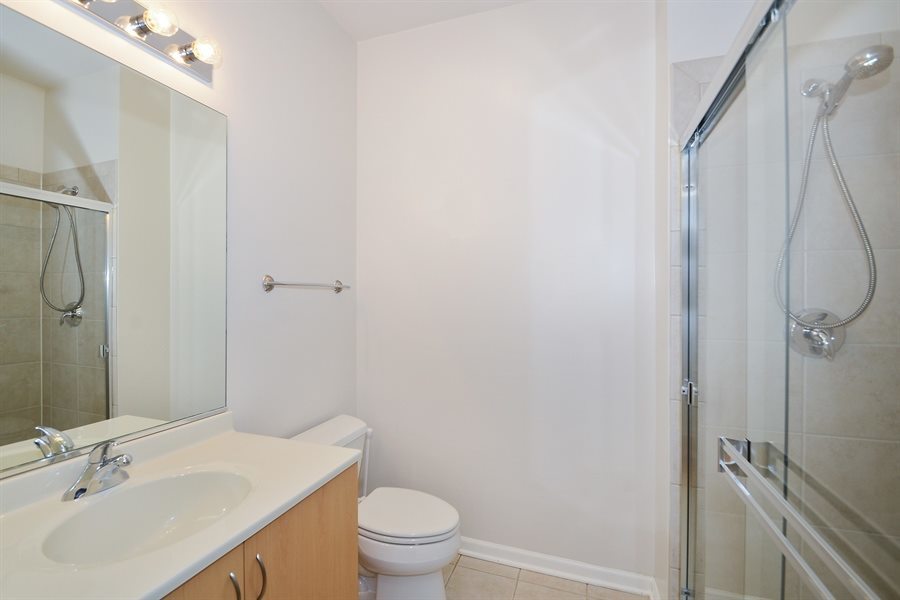 1421 South Halsted Street, Unit 1A Chicago, IL 60607 - Photo 12 of 15 a bathroom with a sink toilet and shower