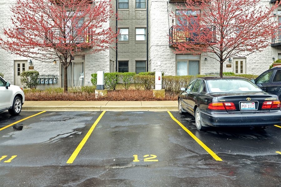 1421 South Halsted Street, Unit 1A Chicago, IL 60607 - Photo 15 of 15 a view of a white house with a swimming pool table and chairs
