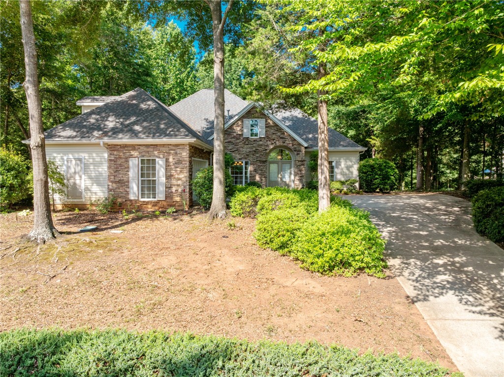 108 Winterbrook Circle Seneca, SC 29678 - Photo 3 of 40 A classic brick and siding home with a welcoming front entrance, framed by mature trees and verdant landscaping.