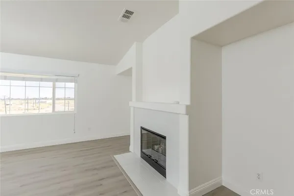 a large bathroom with a granite countertop sink a large mirror and a bathtub