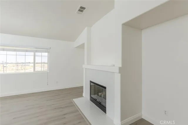 a large bathroom with a granite countertop sink a large mirror and a bathtub
