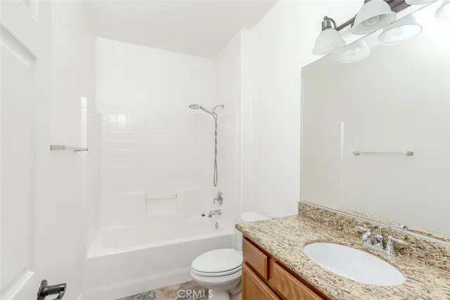a view of a kitchen with a dishwasher cabinets and wooden floor