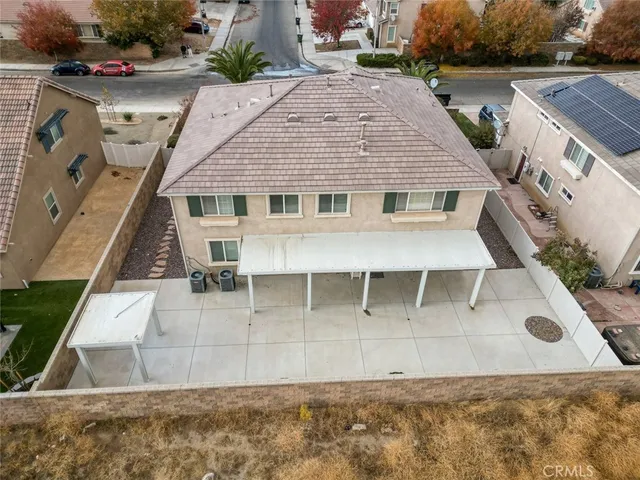 an aerial view of a house with outdoor space