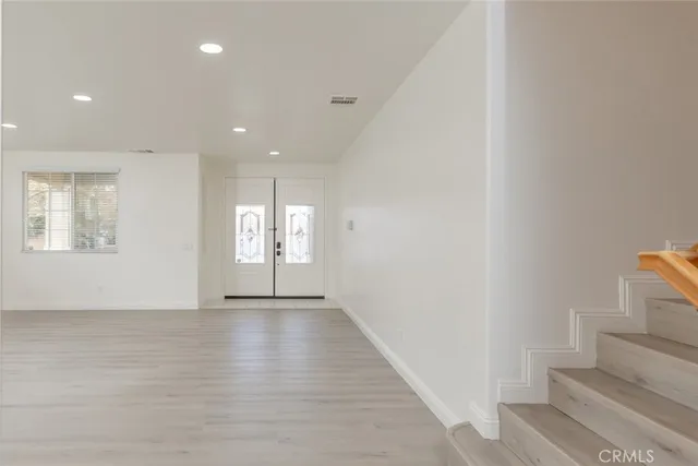 a view of an empty room and window