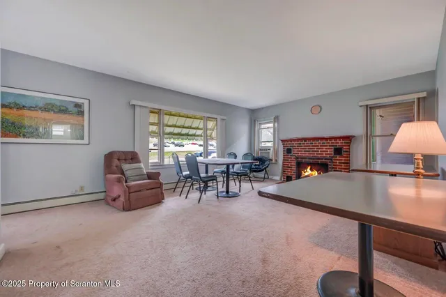 a view of a livingroom with furniture and window