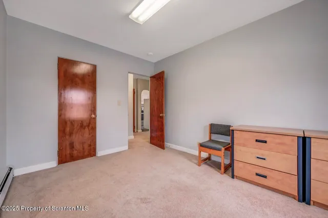 a bathroom with a tub and shower