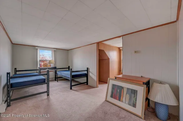 a view of a patio with table and chairs and wooden floor