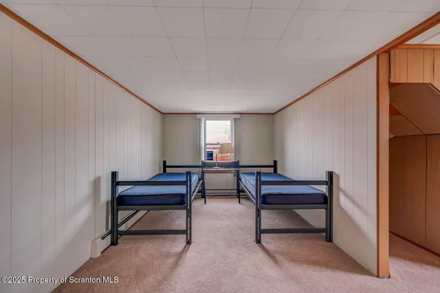 a view of hallway with wooden floor