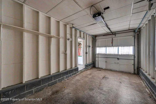 a view of empty room with wooden ceiling