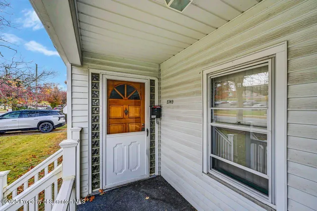 a view of a porch and garden