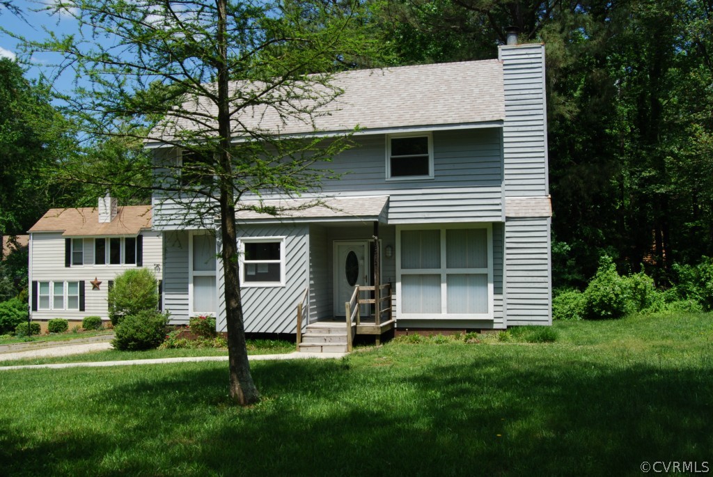8512 Hann Road North Chesterfield, VA 23236 - Photo 2 of 23 a front view of a house with a yard