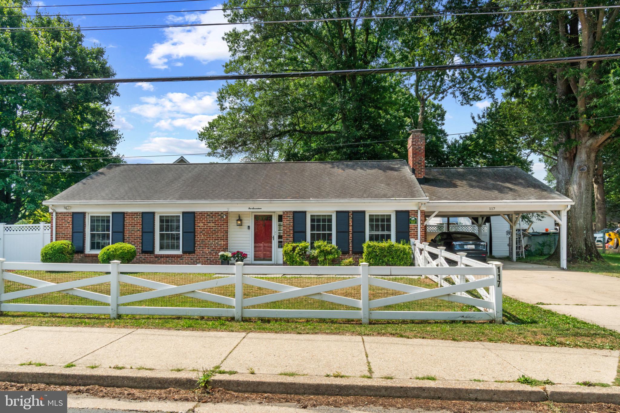 117 Oakwood Road Edgewater, MD 21037 - Photo 3 of 52 Brick facade home featuring a white picket fence,