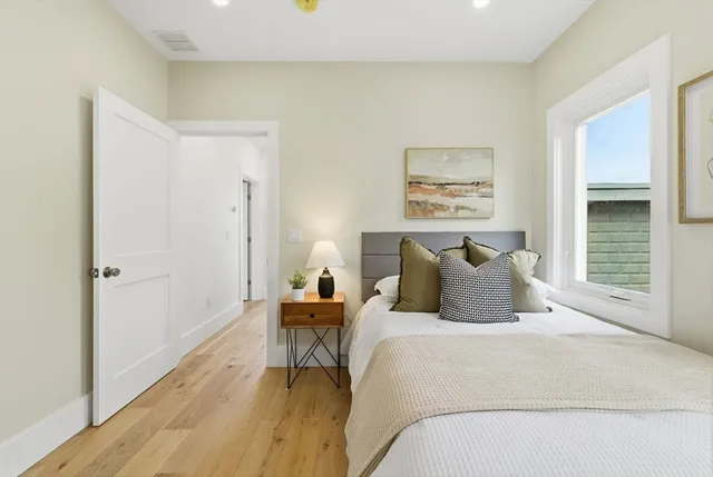 a bedroom with a bed and a table