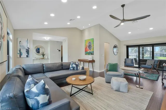 a living room with furniture or couch and a wooden floor