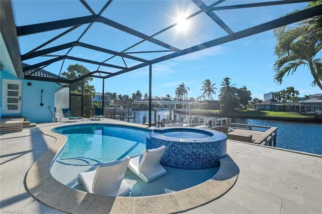 a view of a swimming pool with a patio