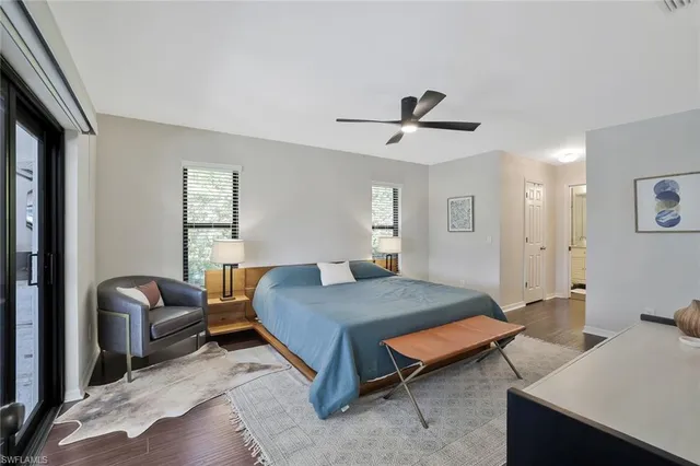 a bedroom with furniture and wooden floor