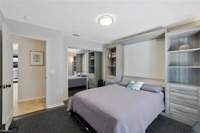 a bedroom with a bed and a closet