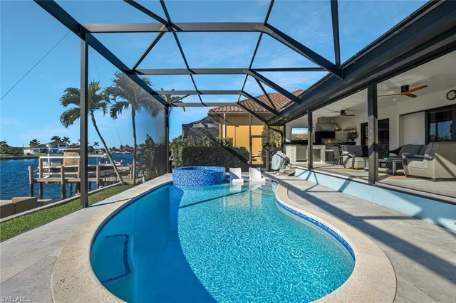 a view of a swimming pool with a patio