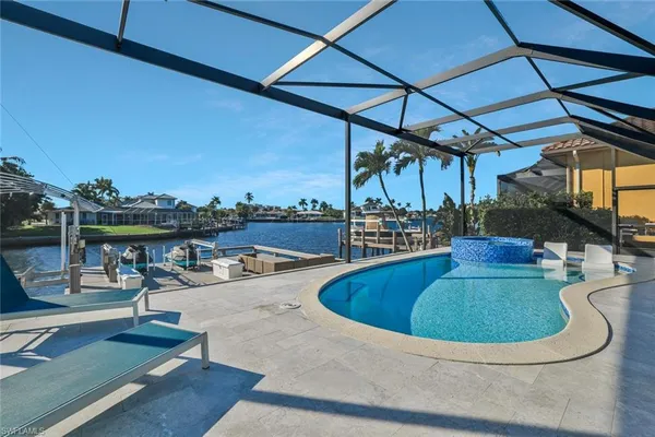 a view of a swimming pool with a patio