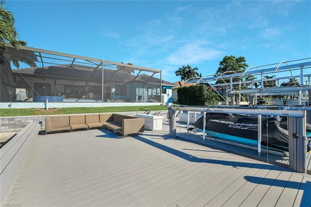 a view of a swimming pool with a patio and a yard