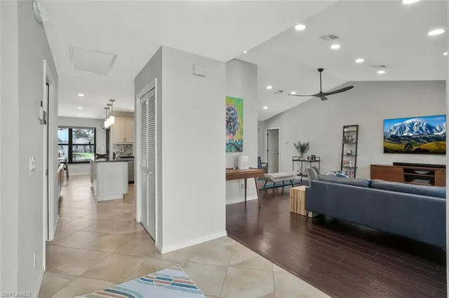 a view of a living room kitchen and a living room