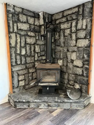a bedroom with a bed and a chandelier fan