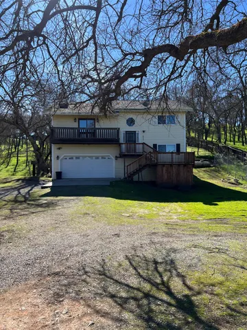 a house view with a swimming pool in front of it