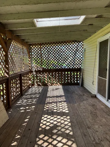a green field with lots of trees
