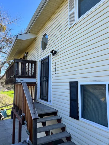 a kitchen with a white cabinets and stainless steel appliances