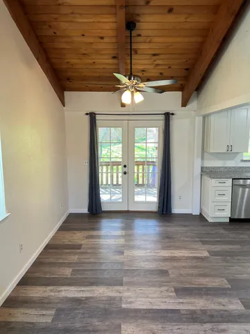 a view of an empty room with a window