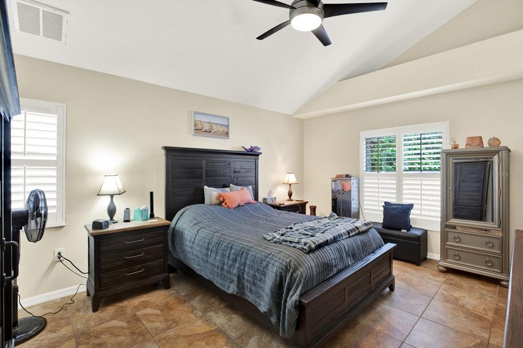 2021 Meadow Rue Court Trinity, FL 34655 - Photo 13 of 41 a bedroom with a bed and furniture