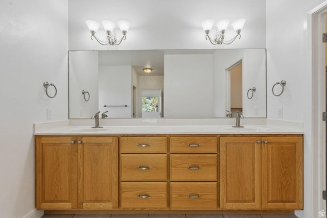 1001 Pine Valley Road Pine Valley, UT 84781 - Photo 38 of 49 Bathroom with suspended lighting, double vanity, and light tile patterned floors