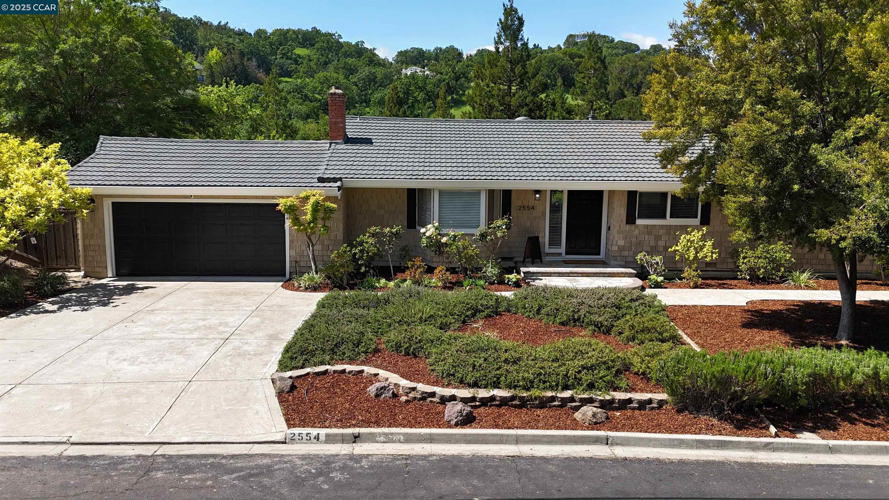 front view of a house with a yard