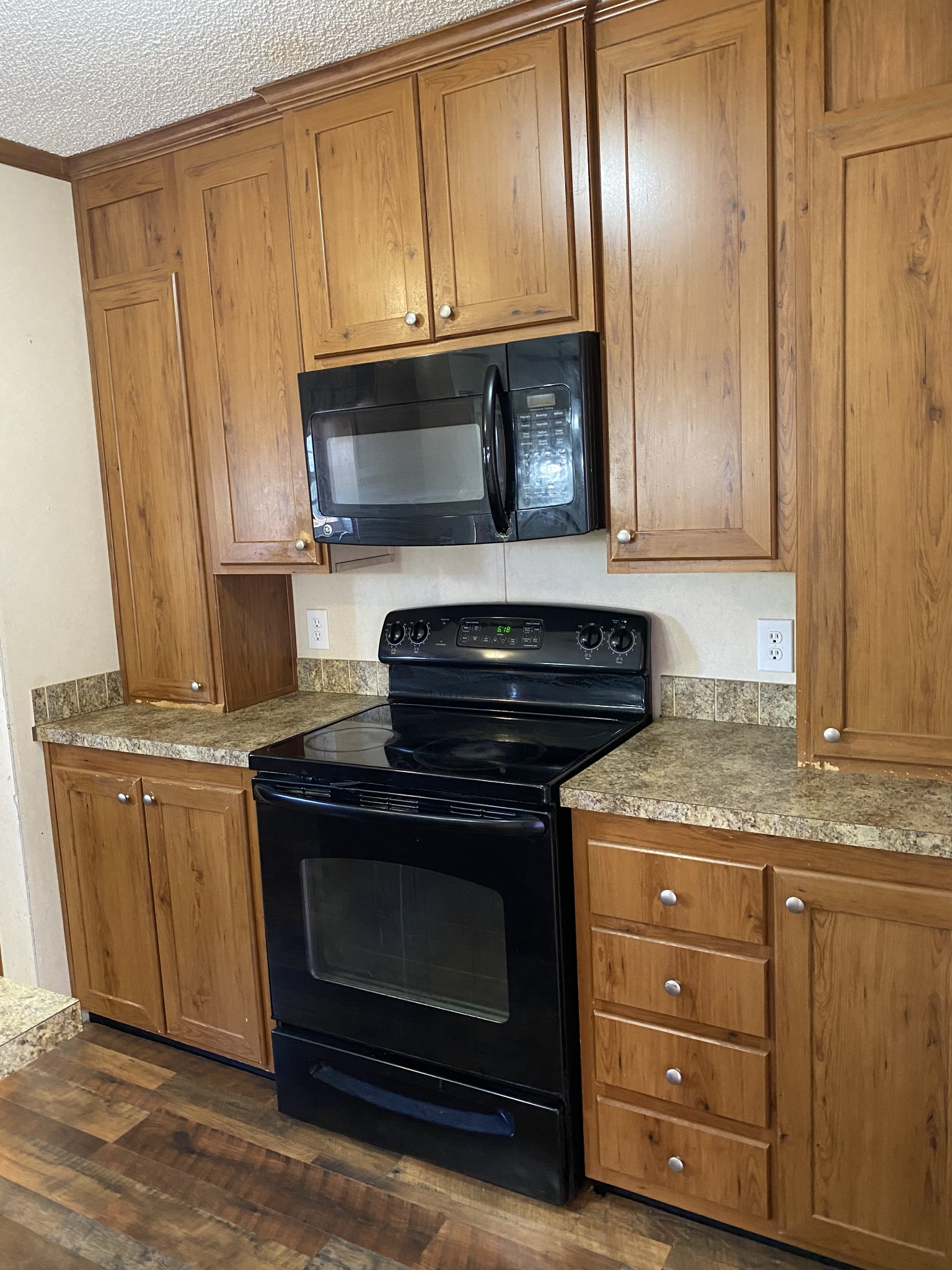 5202 Doss Road Springfield, TN 37172 - Photo 11 of 33 a kitchen with granite countertop cabinets stainless steel appliances and wooden floor