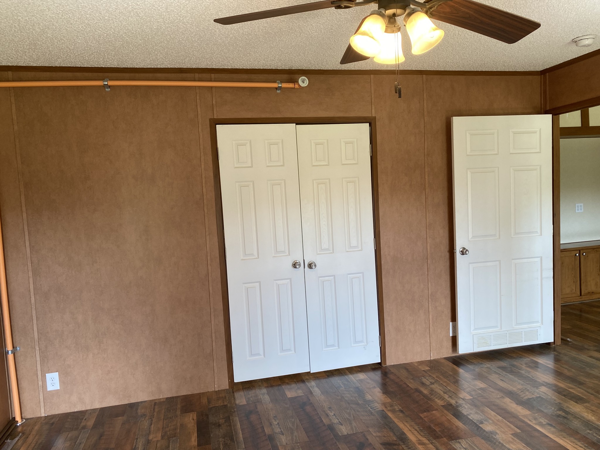 5202 Doss Road Springfield, TN 37172 - Photo 17 of 33 an empty room with wooden floor mirror and windows