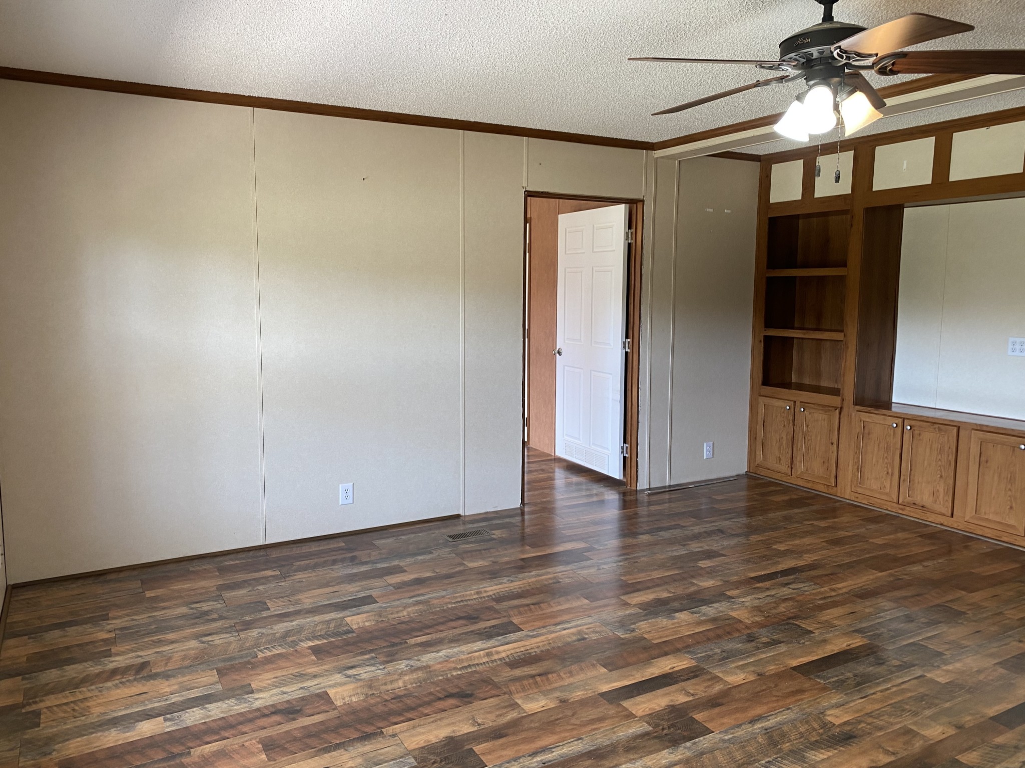 5202 Doss Road Springfield, TN 37172 - Photo 4 of 33 a view of an empty room with wooden floor and a window