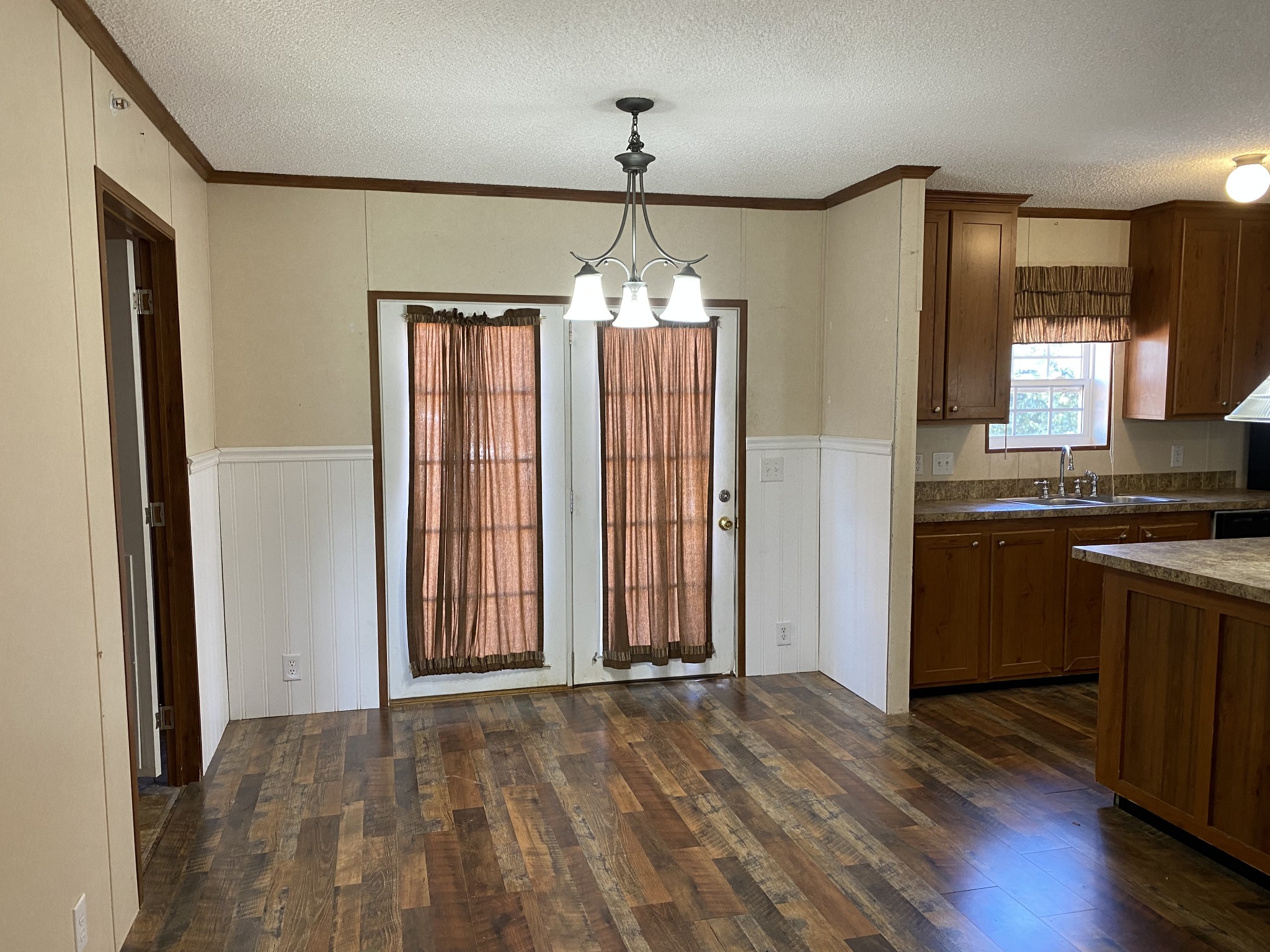 5202 Doss Road Springfield, TN 37172 - Photo 8 of 33 an empty room with wooden floor and windows