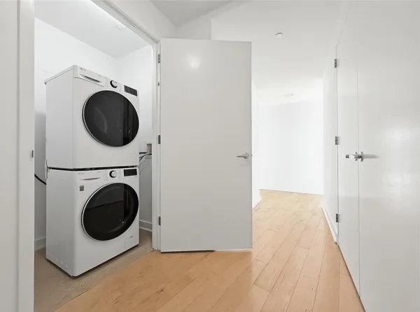 a view of a hallway with washer and dryer